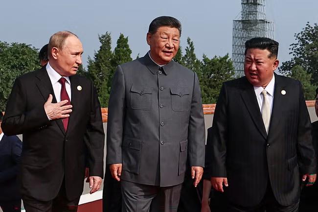 China's Xi proudly parades as Trump sulks on sidelines