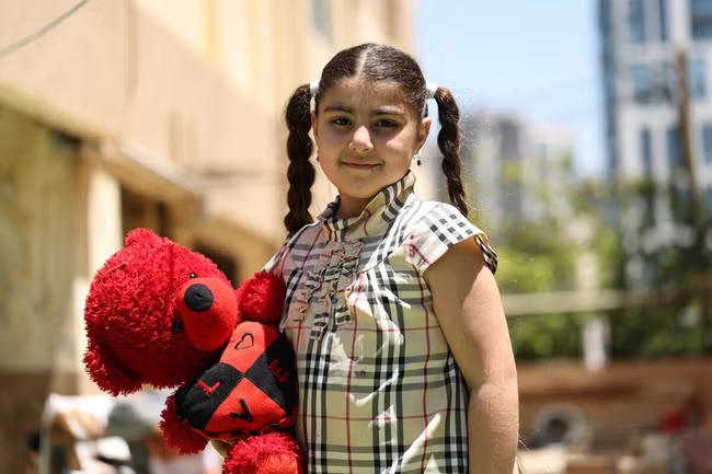 ‘I wasn’t able to bring many toys with me, only one. I just wish for the war to end’