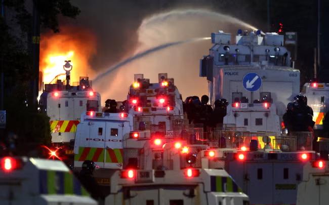 Police use water cannons during second night of riots