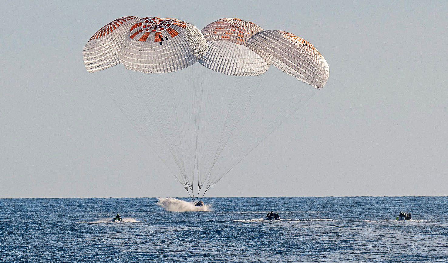 Two Nasa astronauts return to Earth after nine months in space