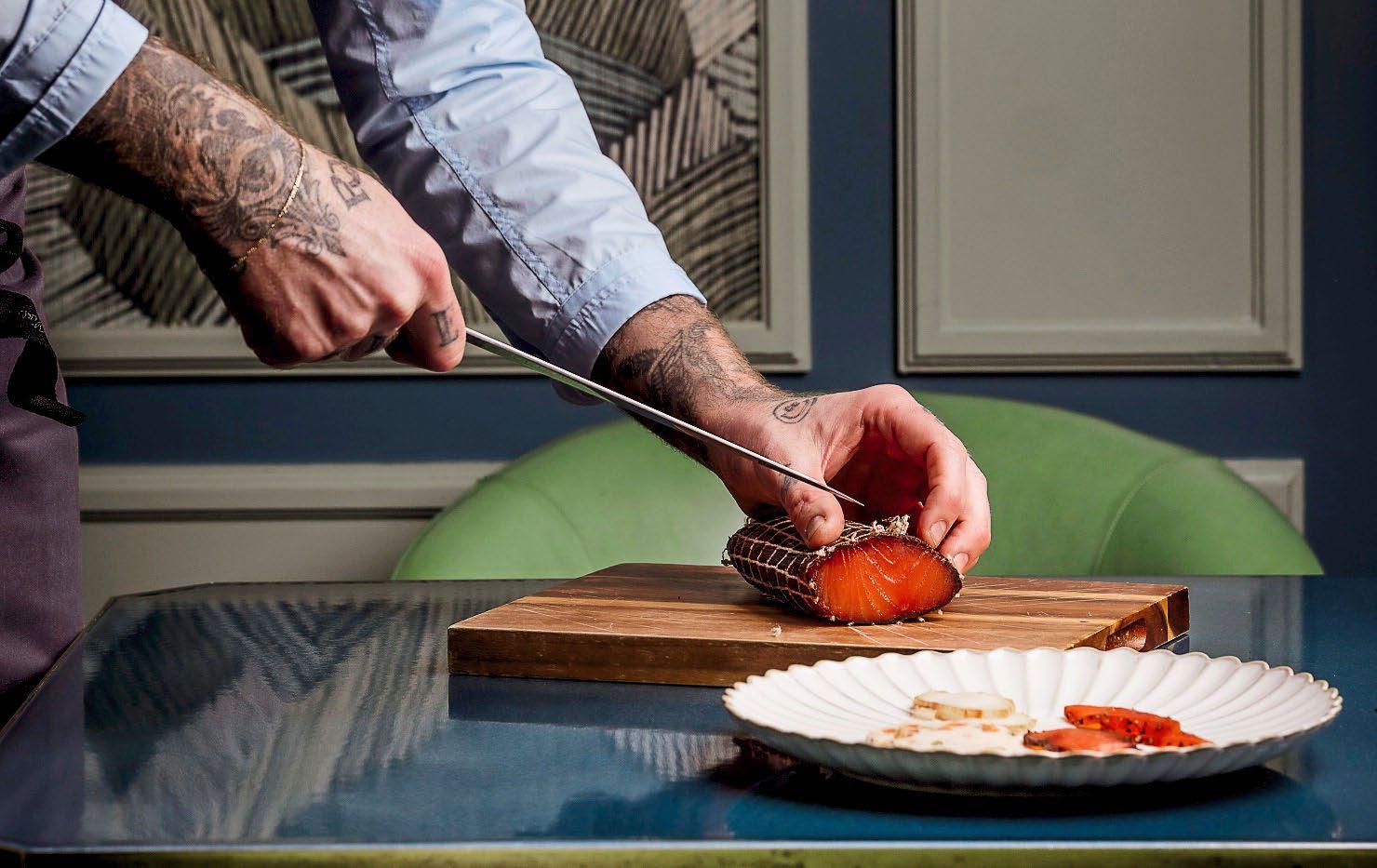 At the table Tom Brown is showing off— and it suits him