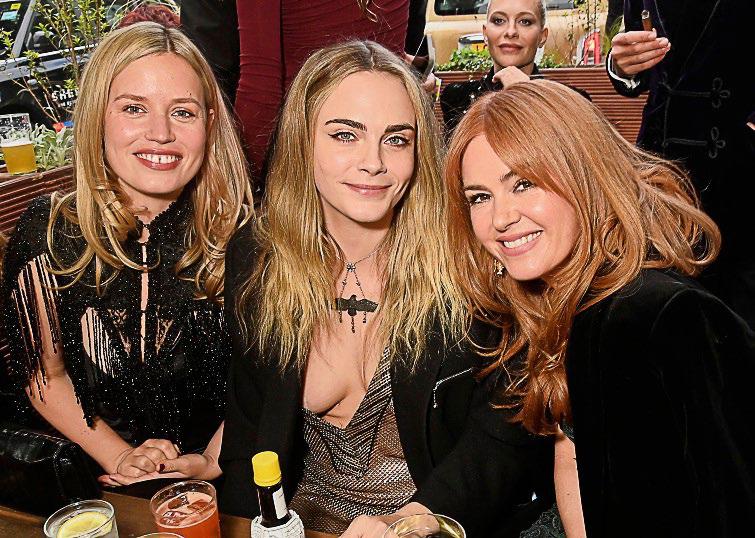 The King and Sir David Attenborough reign over the blue carpet... with a little help from the Delevingnes