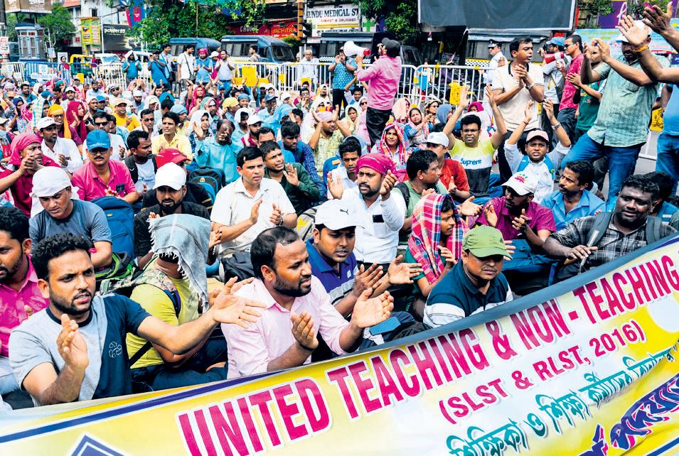Over 400 jobless Bengal school employees block Kolkata road