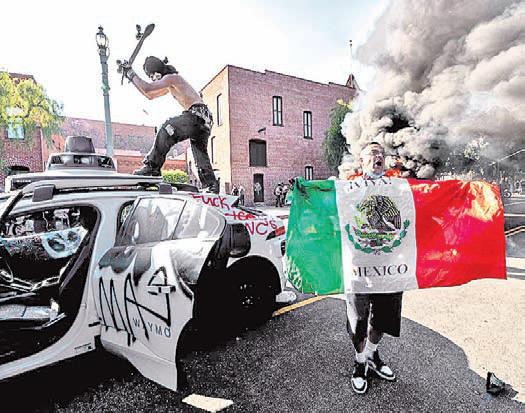 Los Angeles police order immigration protesters downtown to go home