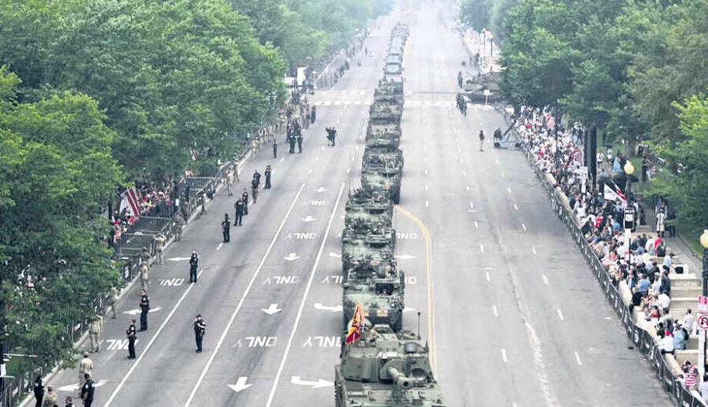After day of protests, Trump's military parade rolls through DC