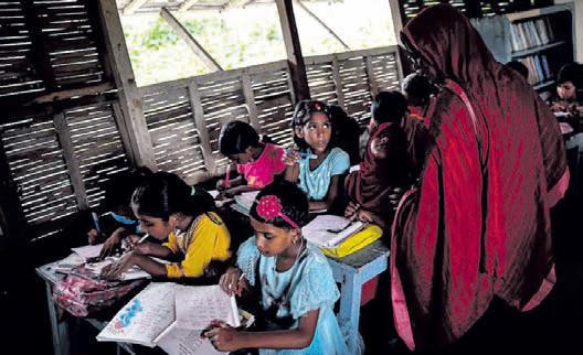 In Bangladesh's flooded plains, schools in boats keep learning afloat