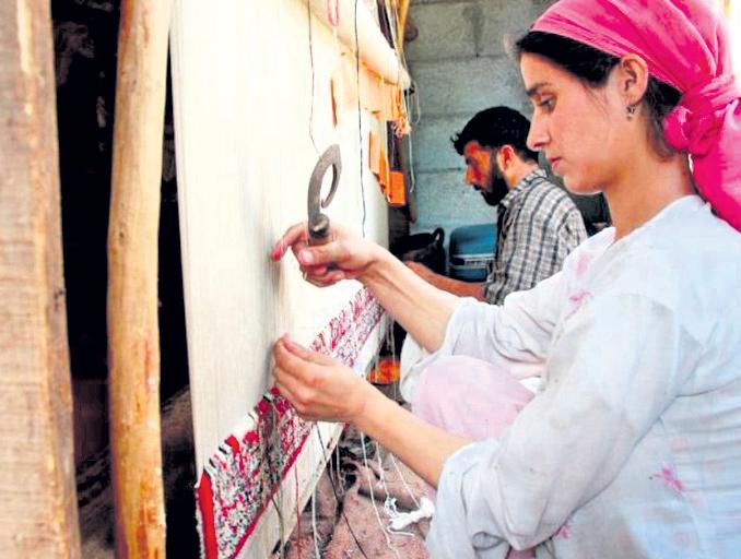 Hobbled by US tariffs, carpet weavers struggle to stay afloat