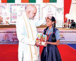 Shah distributes books at Ahmedabad International Book Fair