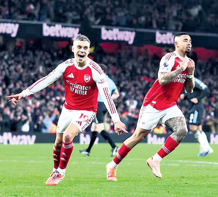 ARSENAL THRASH VILLA TO END YEAR AT TOP
