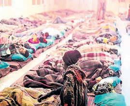 DELHI'S NIGHT SHELTERS FOR HOMELESS Warm beds, hot meals, roof over head