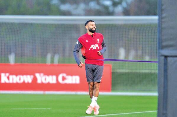 Salah Back in Liverpool After Talks with Slot