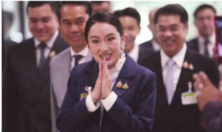 Thai prime minister survives a challenge by rivals who say her father is pulling the strings
