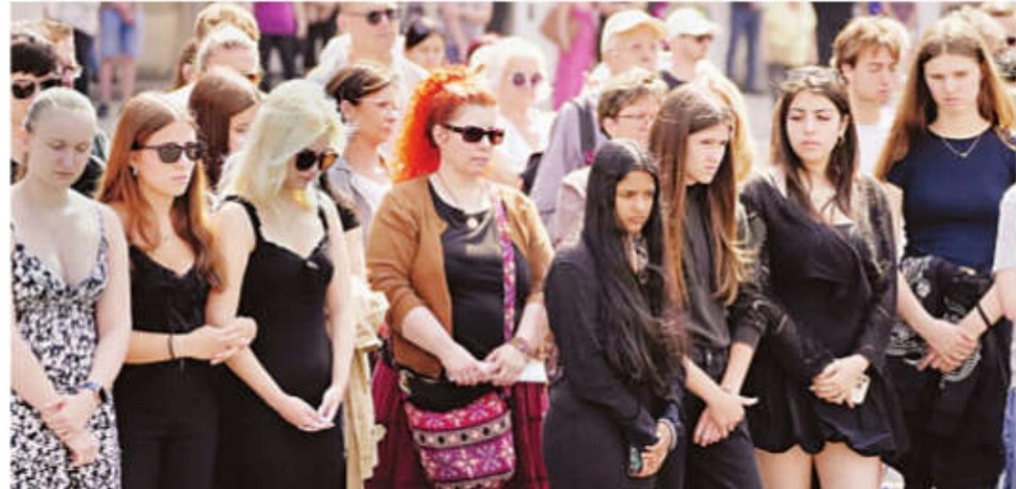 Austria falls silent for a minute as questions remain about the motive for a deadly school shooting