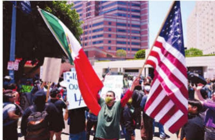 LA police swiftly enforce downtown curfew as protests continue