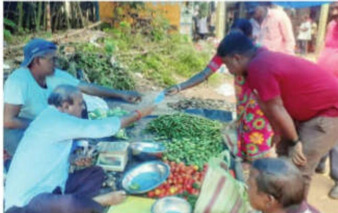 SBSTC chairman sells vegetables at village haat