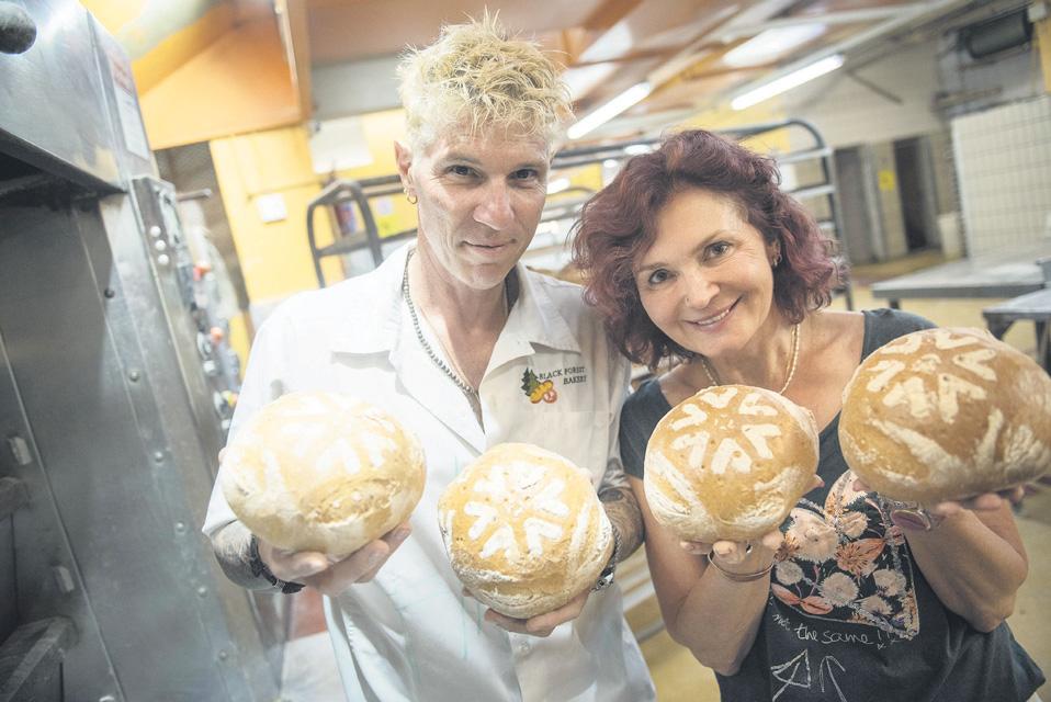 Family kneading own bread