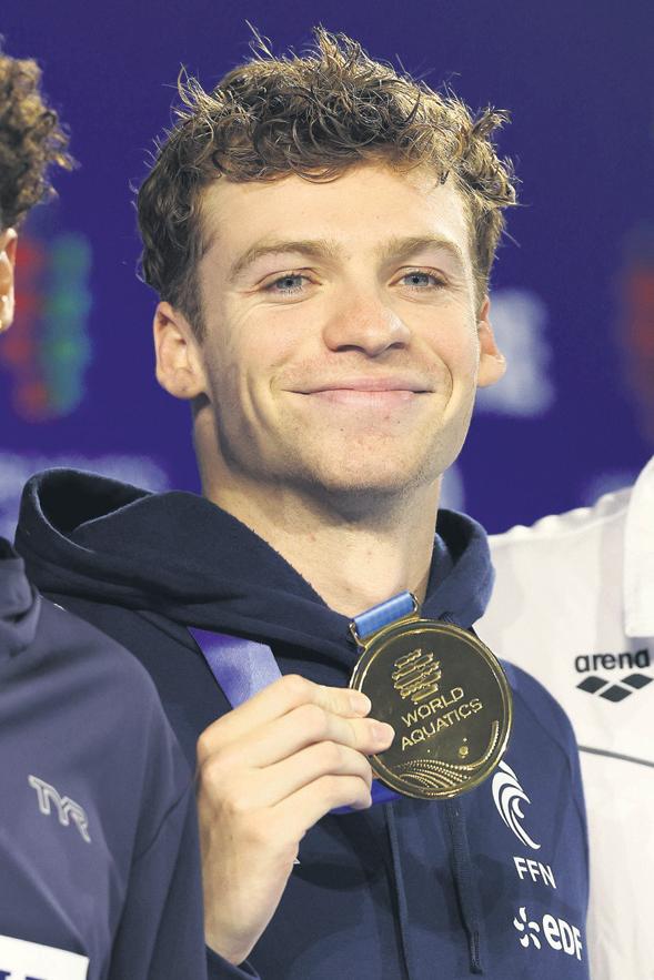 Sleepless in Singapore: Marchand wins gold