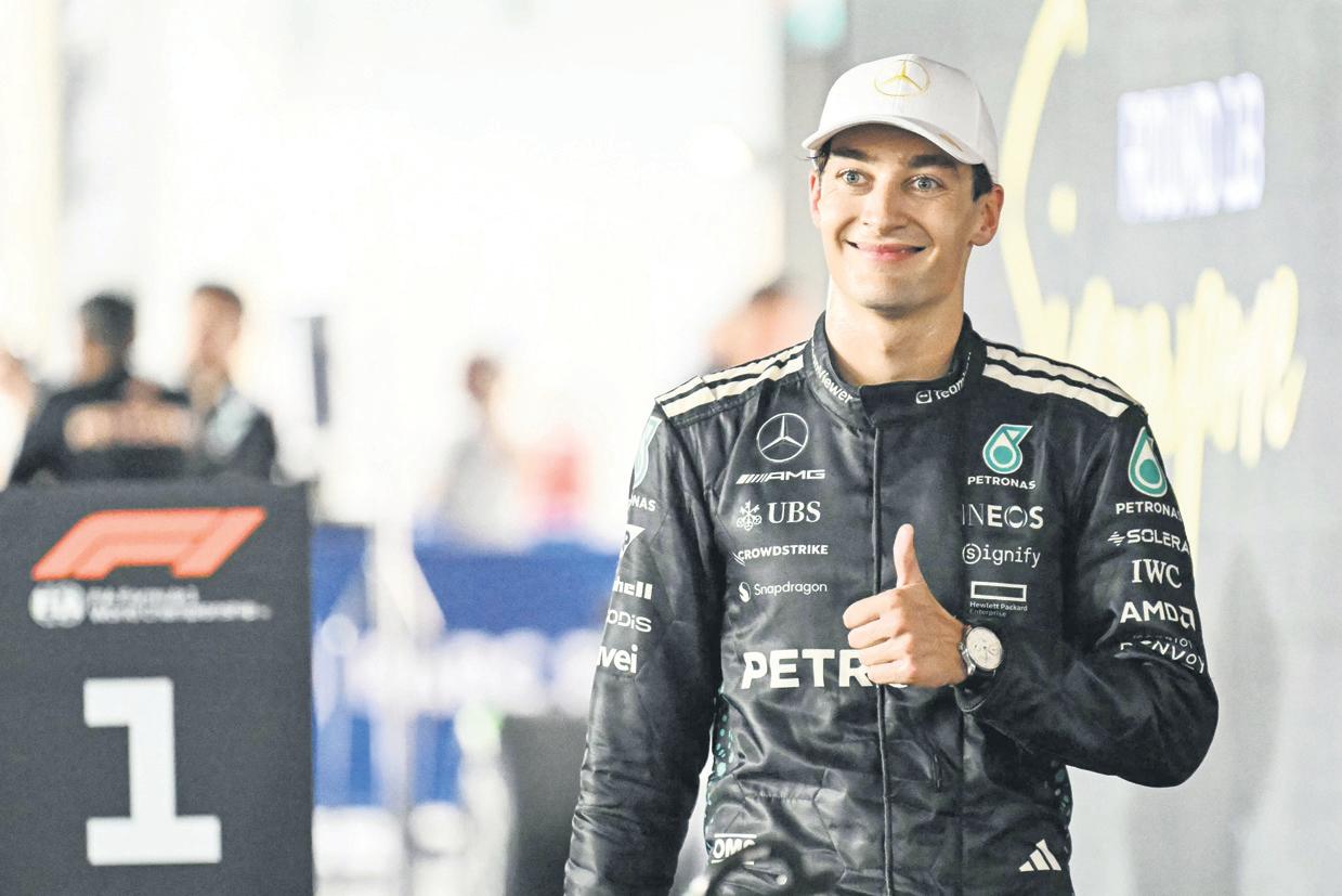 Russell storms to win as McLaren seal title