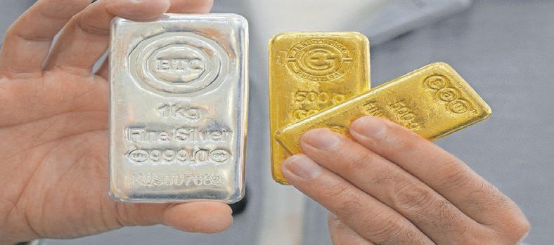 Equities sink, gold and silver hit highs