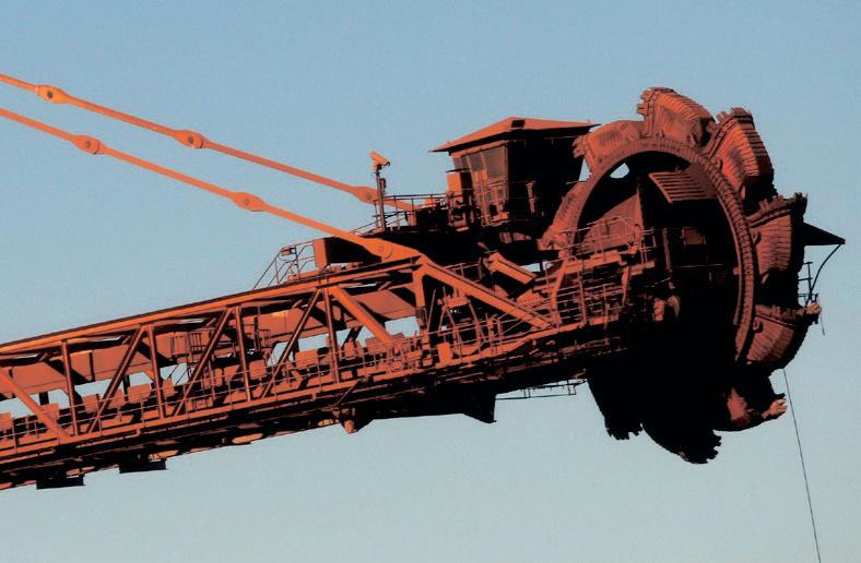 BHP reports strong performance with record copper and iron ore production.