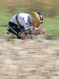 Evenepoel pumps the pedals to win time trial
