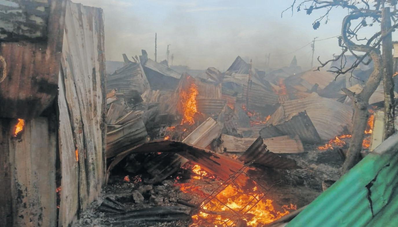 Residents dodge gunfire after blaze destroys homes