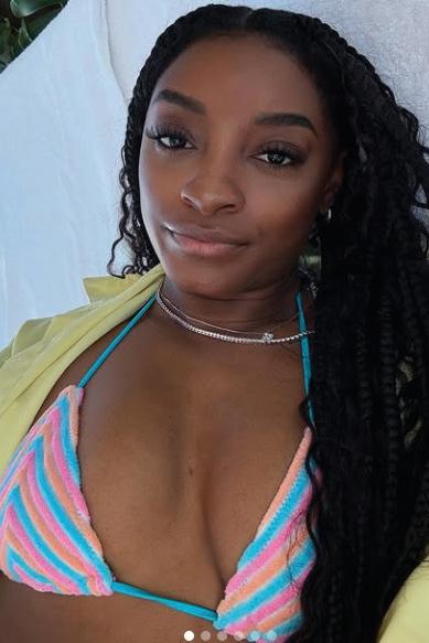 BILES' BOOB JOB BUZZ