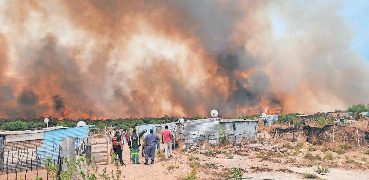 Families flee their homes and roads closed due to raging fires