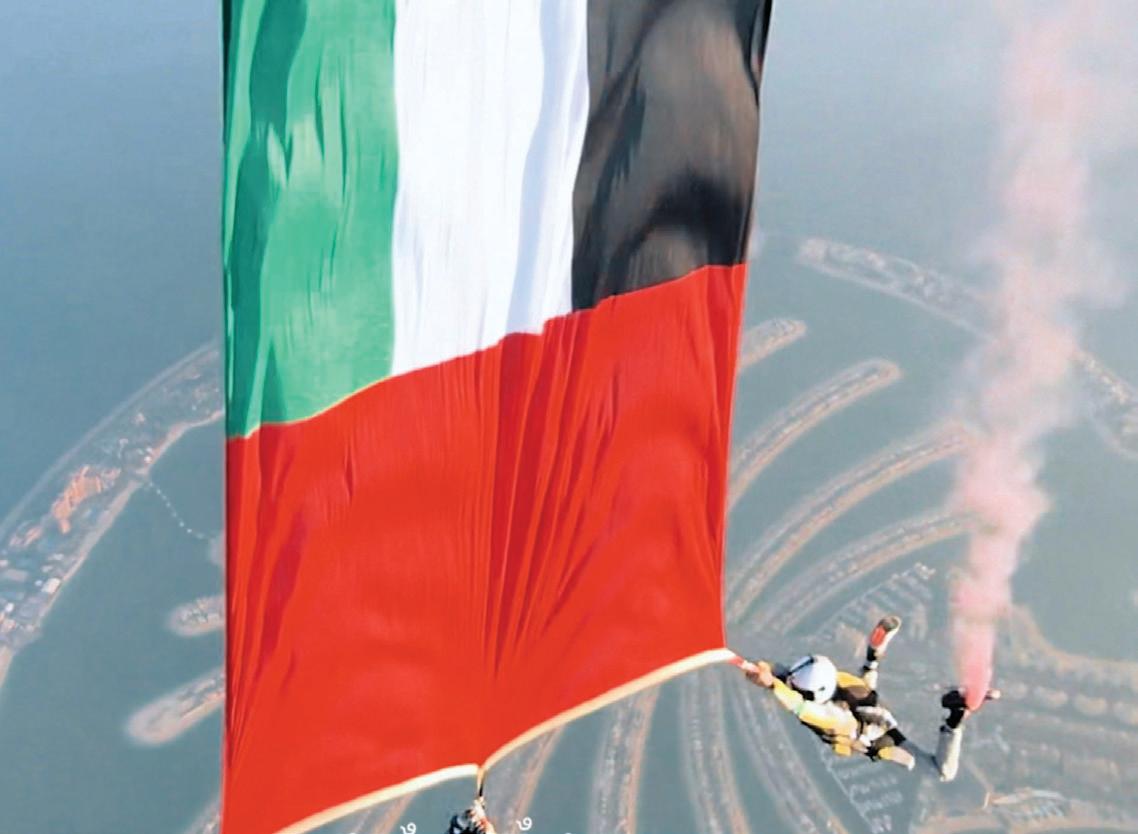 Dubai skydivers perform freefall carrying UAE flag