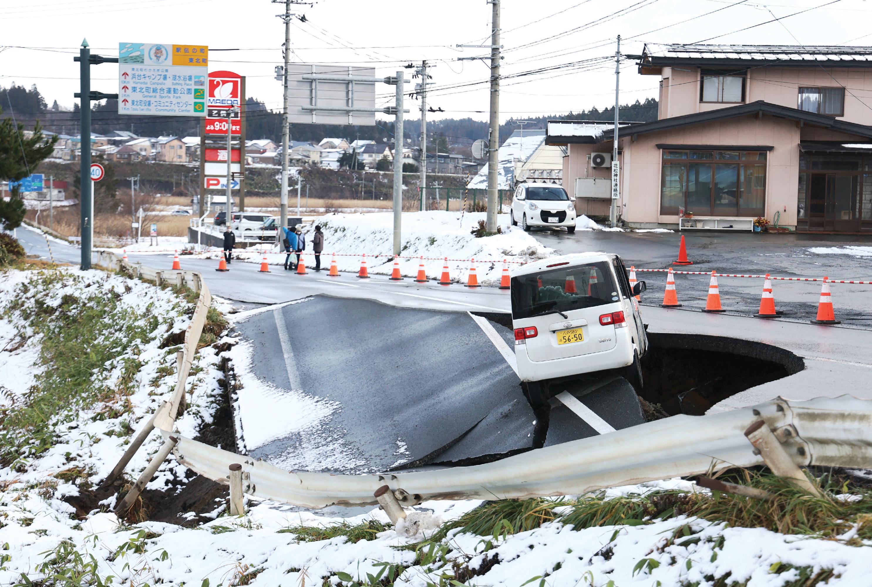 Major Japan quake injures dozens and damages roads