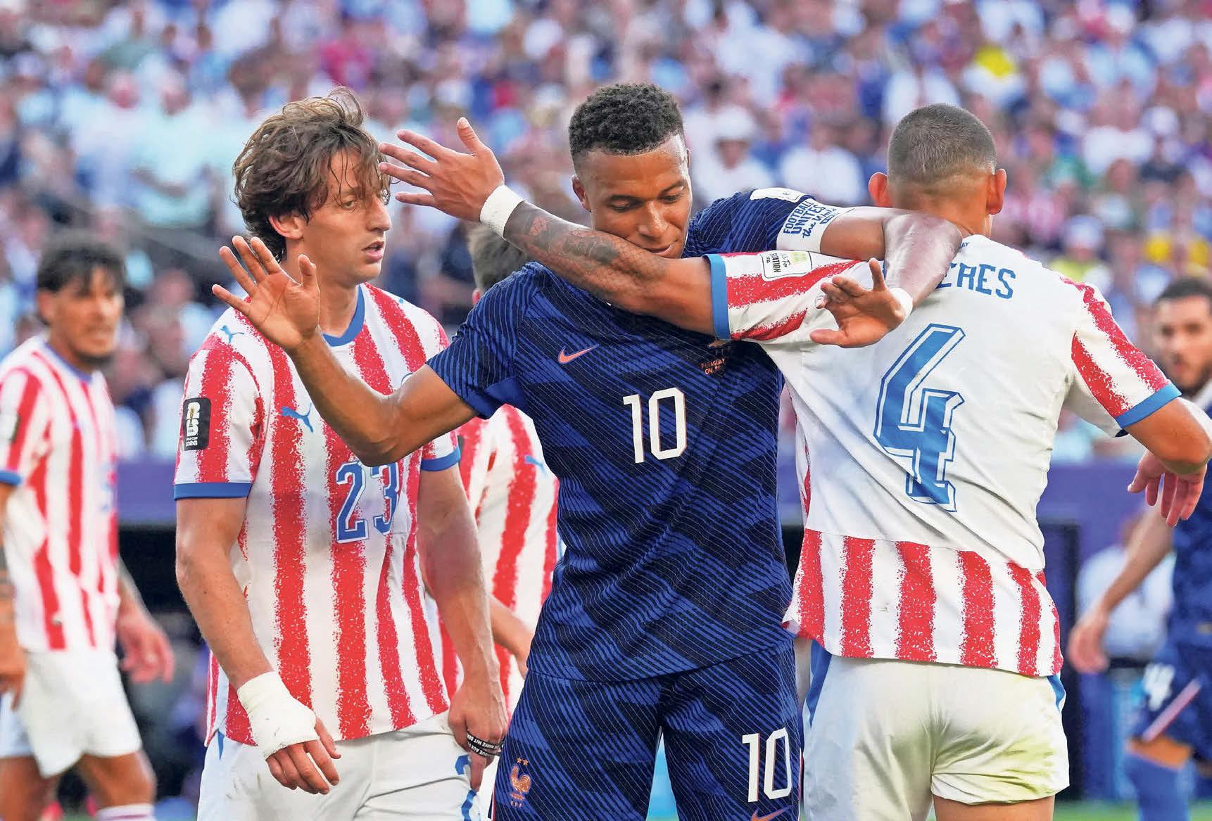 Deschamps keeps his cool as France survive Paraguay’s provocation