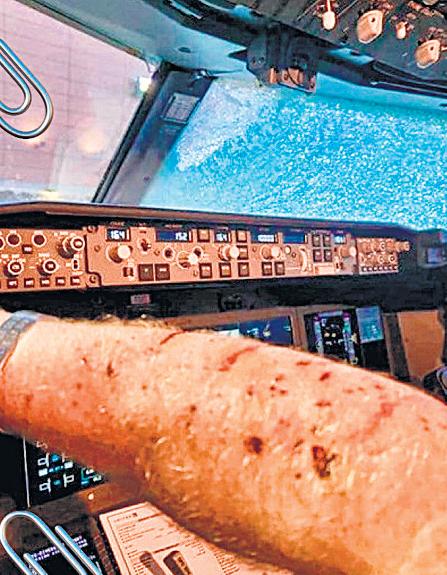 { PILOT INJURED } PLANE WITH 140 PASSENGERS DIVERTED Space debris shatters Boeing windshield mid-air