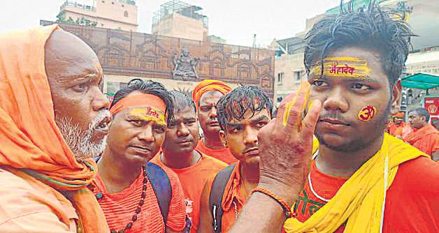 Devotees welcomed with flower shower at KV temple