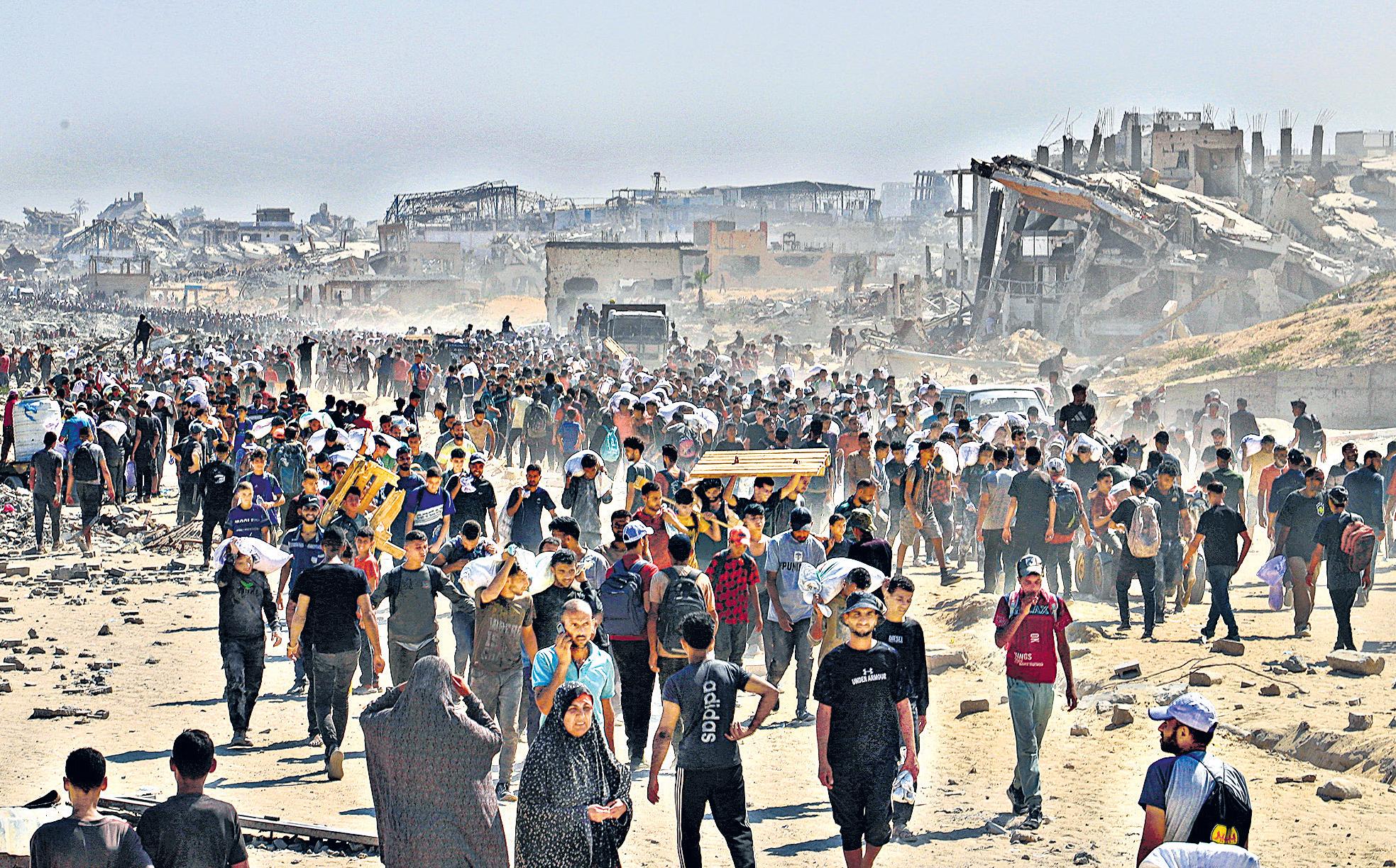 Israel says it’s opening routes to allow aid convoys into Gaza Strip