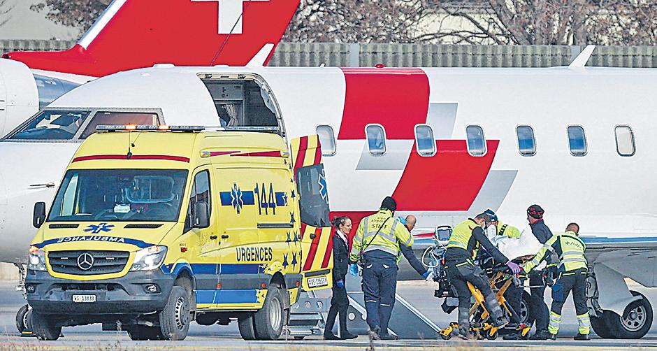 Swiss investigators rush to identify bar fire victims