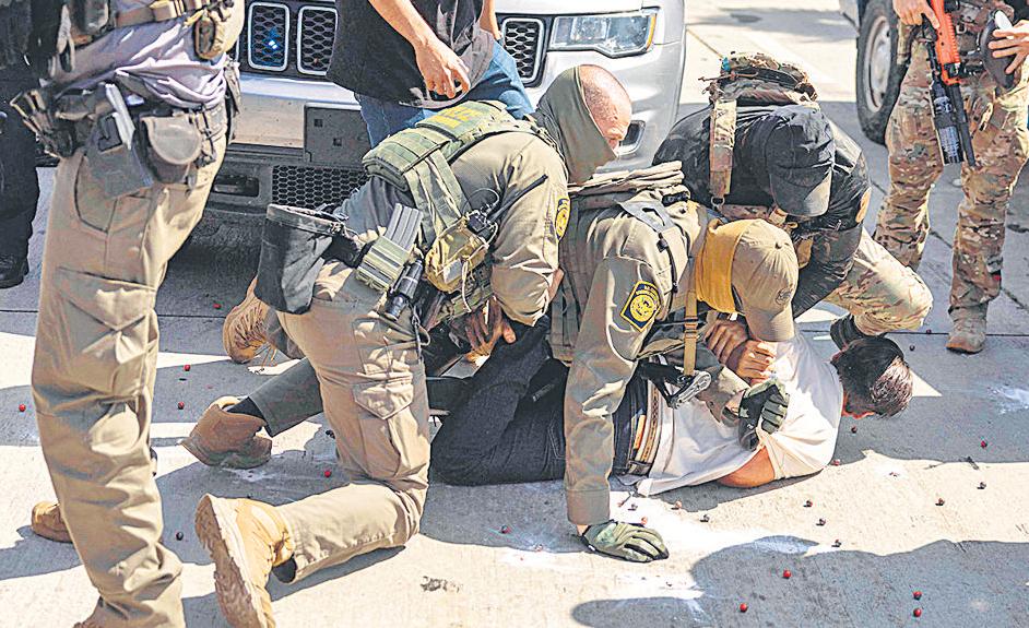 Snatch and detain: US officials defend aggressive immigration raid tactics