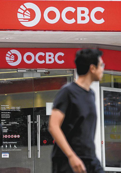 OCBC posts record profit, plans $2.5b capital return