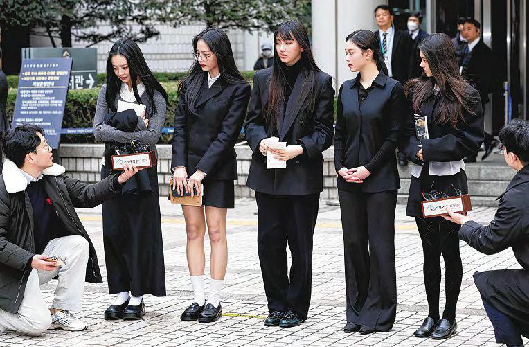 K-pop stars NewJeans make surprise cameo as key trial begins