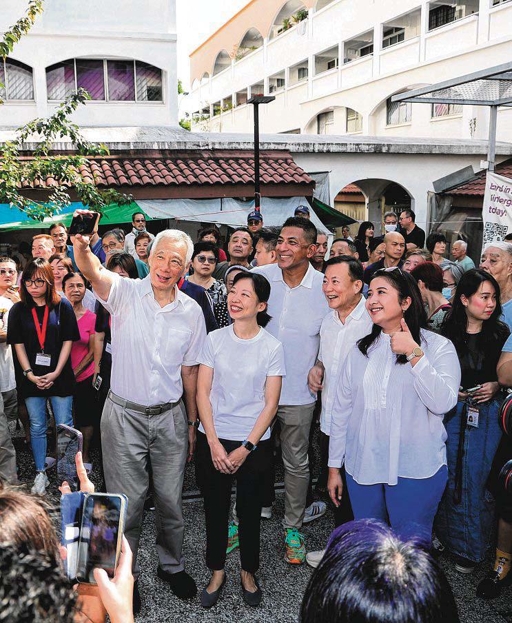 Jasmin Lau and Victor Lye spotted in Ang Mo Kio GRC along with SM Lee