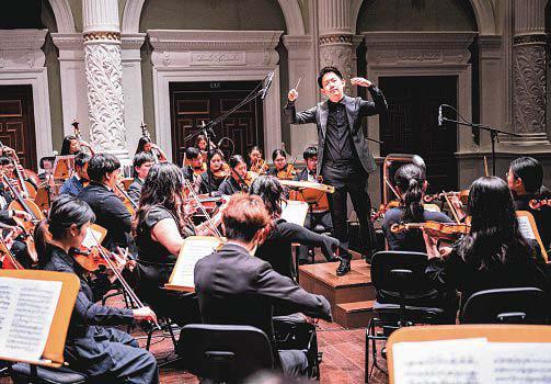 Conductor Lin Juan leads Nafa Orchestra in popular staples