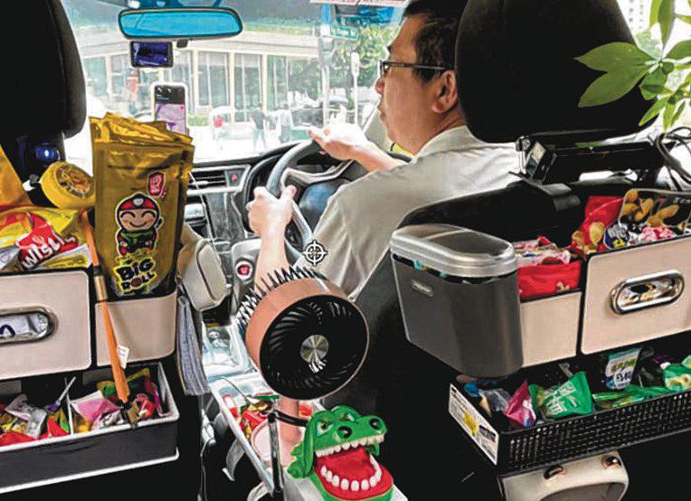 Grab driver spreads cheer with snacks, bottled water