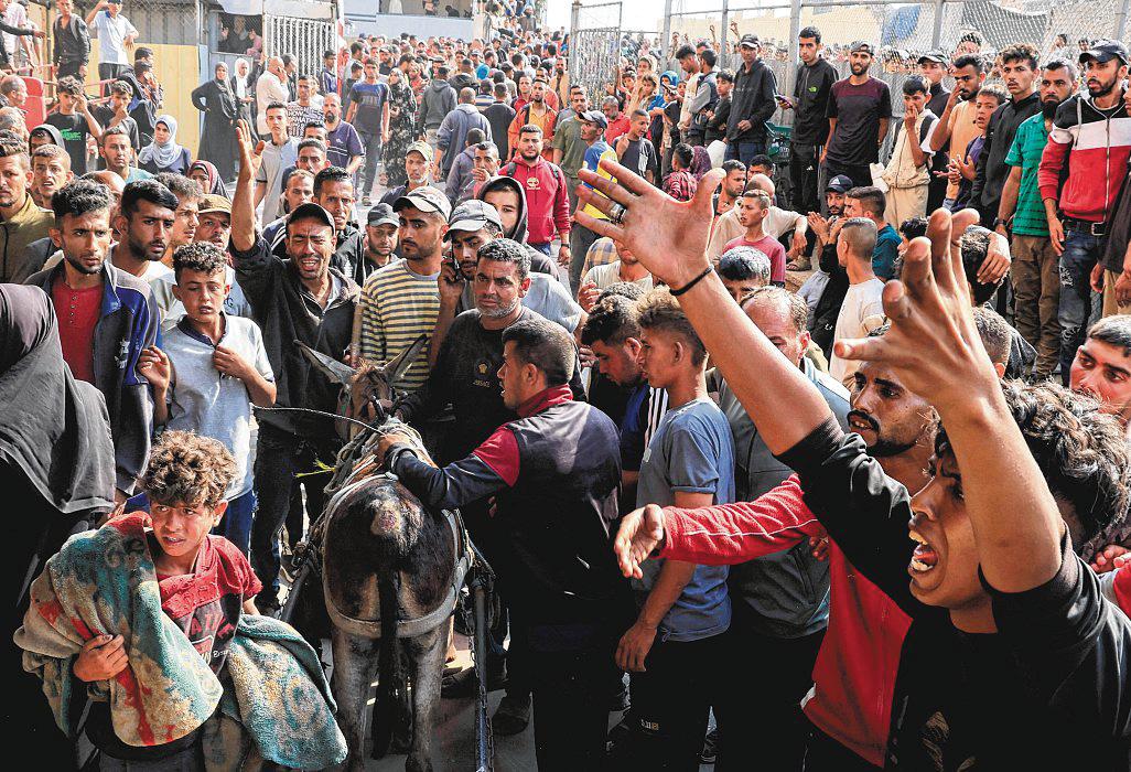 Israeli tanks fire on Gaza crowd trying to get food aid, killing 51