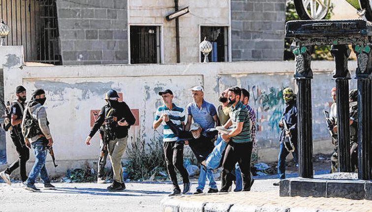 Syrian forces move to quell sectarian clashes; Israel strikes tanks