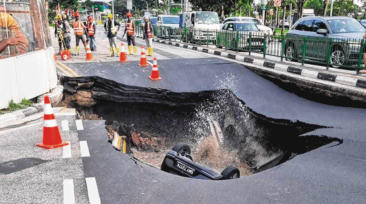Woman taken to hospital after car falls into sinkhole on Tanjong Katong Road