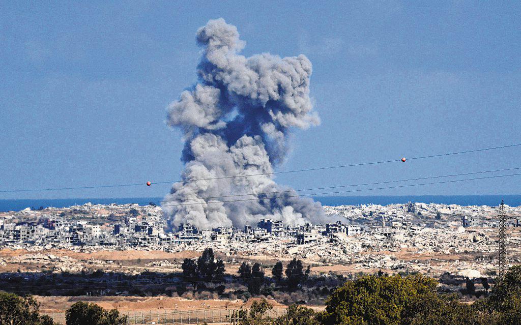 Israeli forces shell Gaza on war anniversary; militants fire rockets