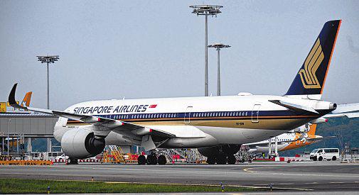 SIA unveils special payout even as profit takes a hit