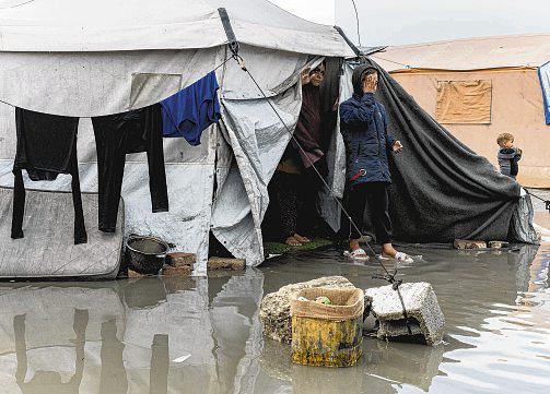 Displaced Gaza residents face more misery as heavy rain lashes enclave
