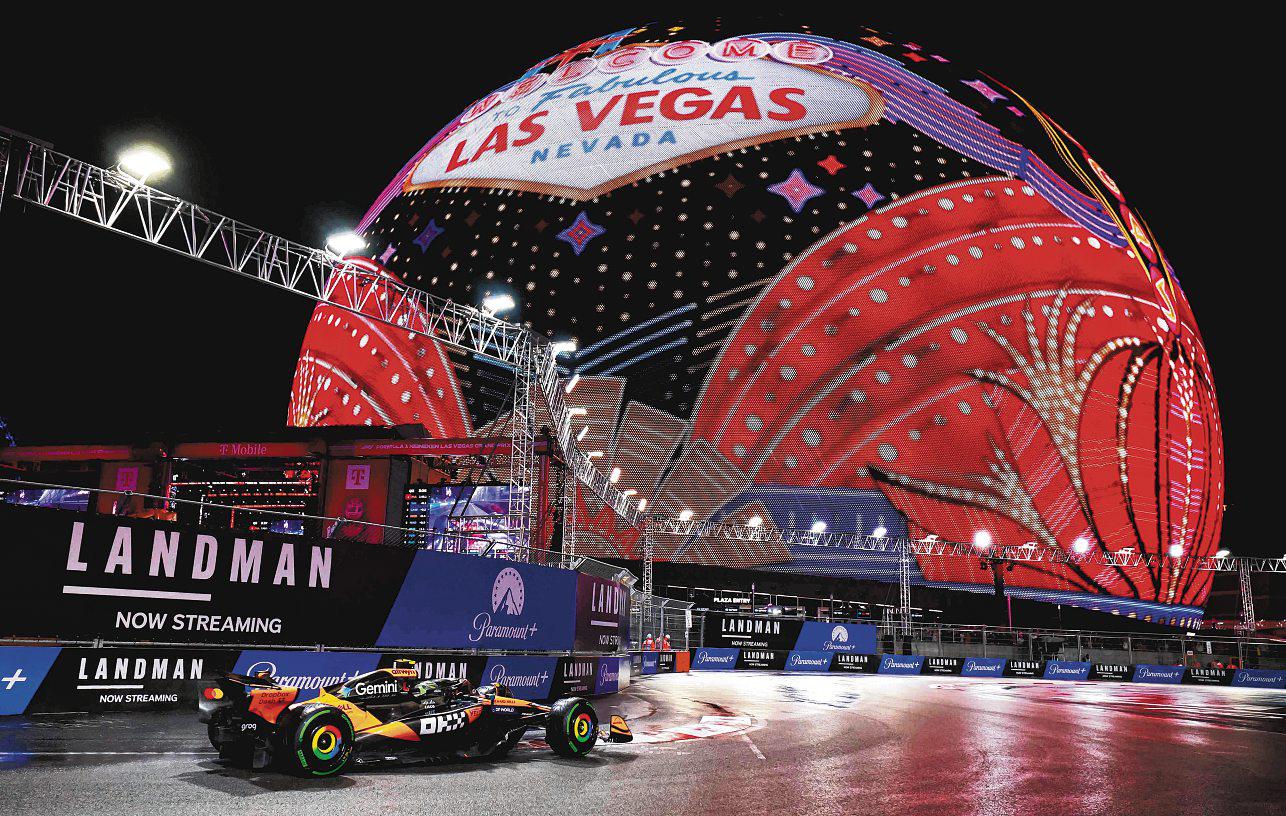 POLE FOR 'STRESSED' NORRIS IN WET VEGAS