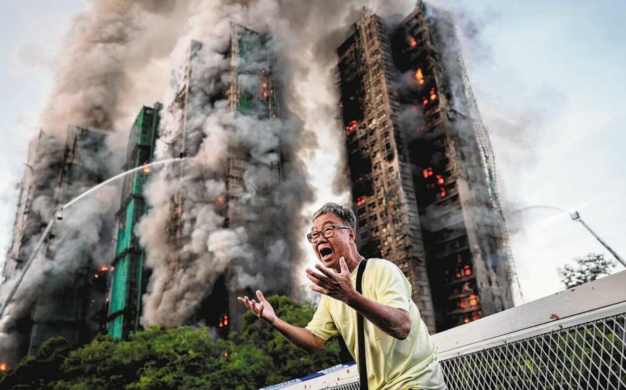The photo that became a symbol for Hong Kong’s deadly blaze