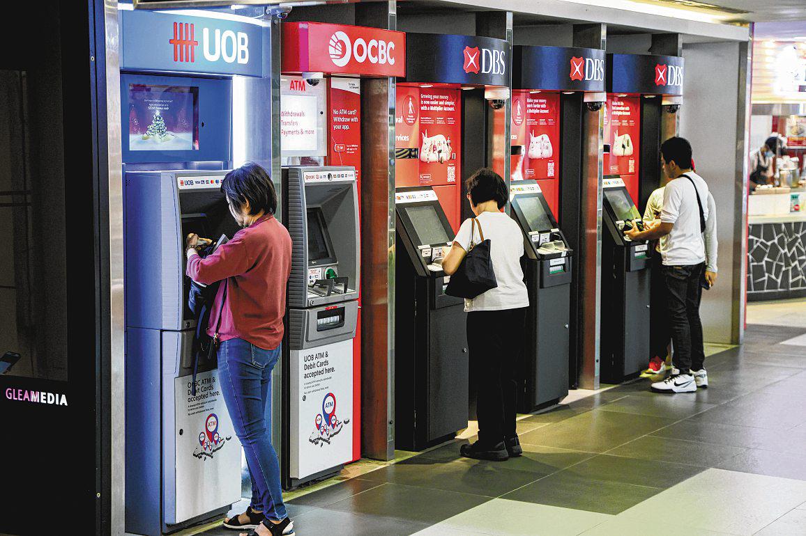 DBS and OCBC shares hit record highs, but UOB lags behind its peers